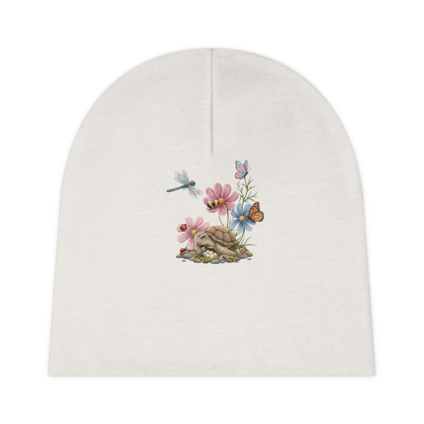 Soft white infant turtle beanie with delicate turtle artwork, made for everyday warmth and tiny hatchlings.