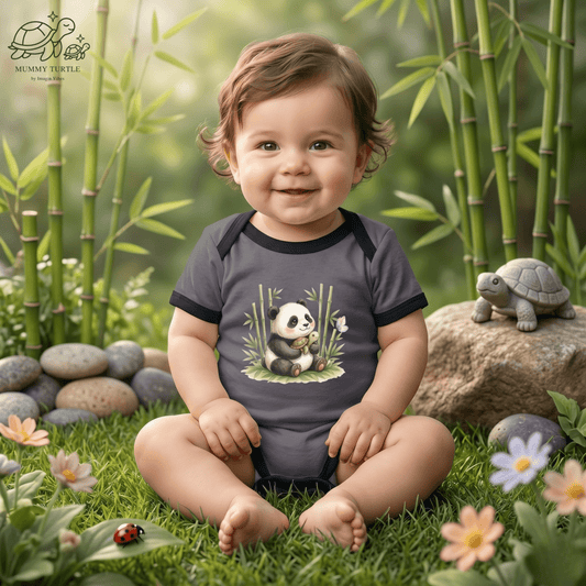 Infant panda bodysuit worn by a baby outdoors, featuring Bamboo Panda artwork for sweet little adventures.