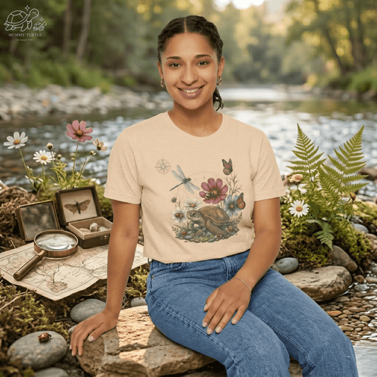 Garden graphic t-shirt shown on a model in soft beige, highlighting the Blossom Turtle design and relaxed everyday fit.