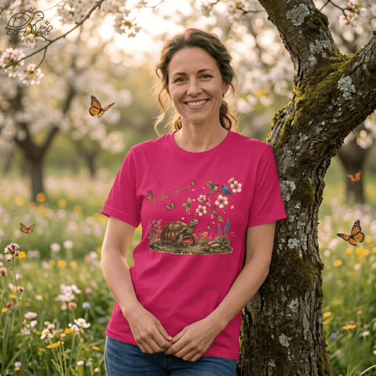 Hello Spring unisex jersey tee featuring a turtle, cherry blossoms, songbirds, and butterflies in a vibrant floral setting.
