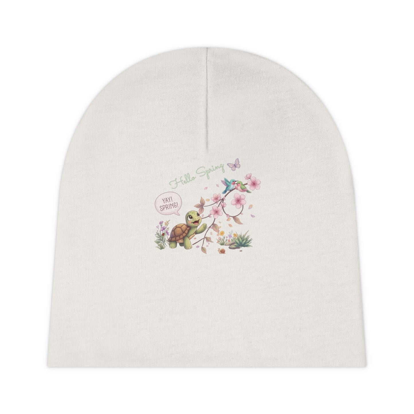 Soft white infant spring beanie with a delicate Mummy Turtle turtle and blossom artwork, designed as a cozy everyday accessory for tiny hatchlings.