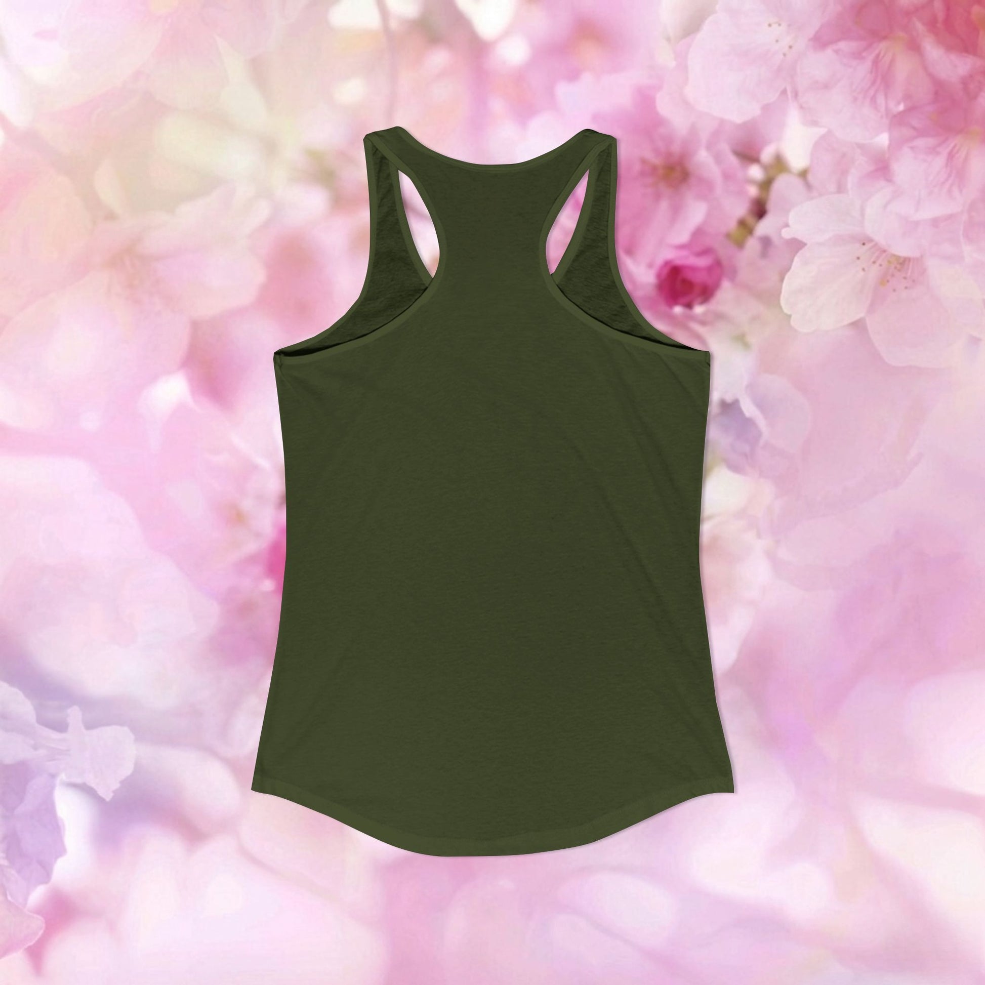 Vintage botanical racerback tank in olive green against a soft pink floral background.