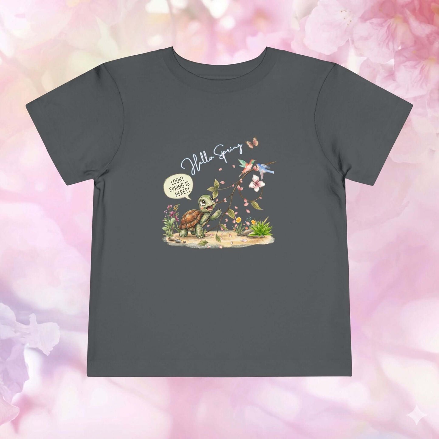 Toddler spring shirt featuring a cute turtle with flowers and butterflies, celebrating the arrival of spring.