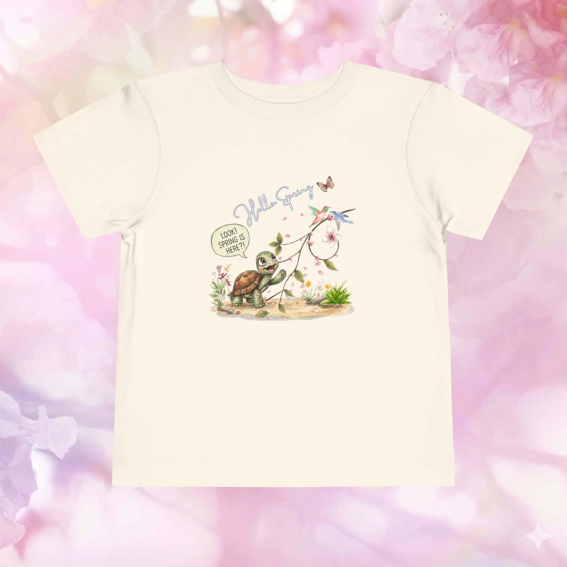 Toddler spring shirt featuring a cute turtle and spring flowers, perfect for celebrating the season.