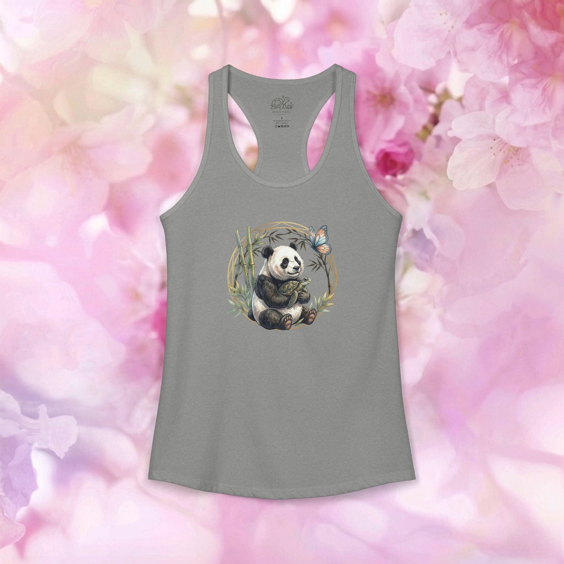 Panda and turtle racerback tank featuring a panda and butterfly in a bamboo grove, set against a floral background.