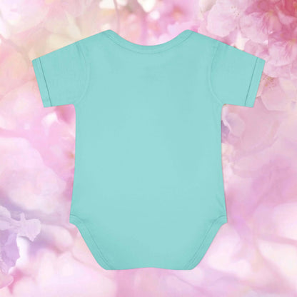 Plain back of the aqua Harvest Friends Infant Bodysuit displayed against a soft pink floral background.