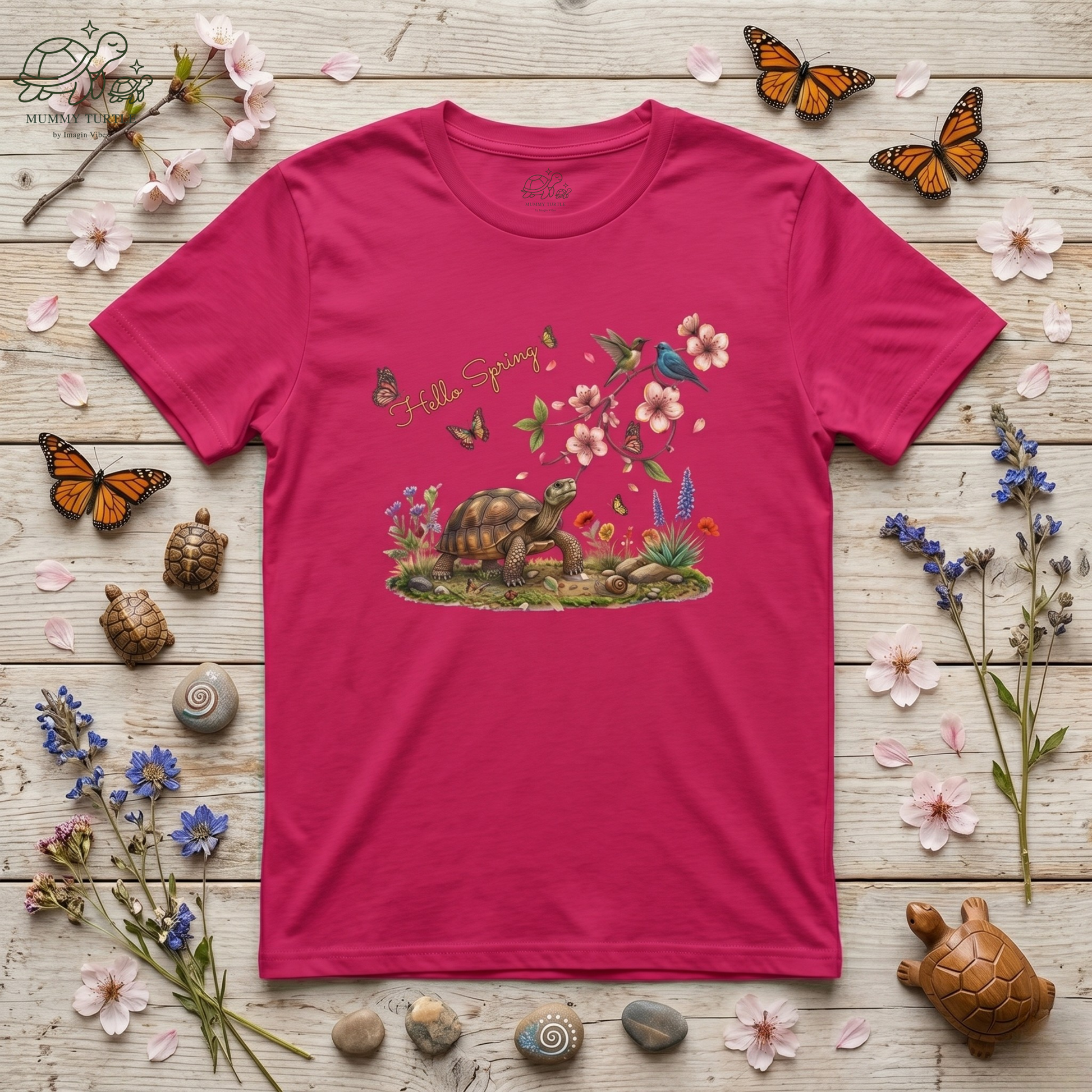 Hello Spring unisex jersey tee featuring a turtle, cherry blossoms, and butterflies on a pink background.
