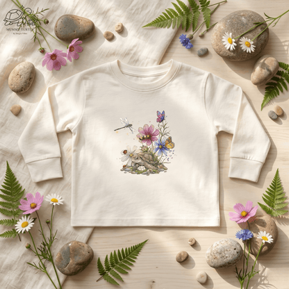 Toddler turtle long sleeve shirt with floral and butterfly design on a light background.