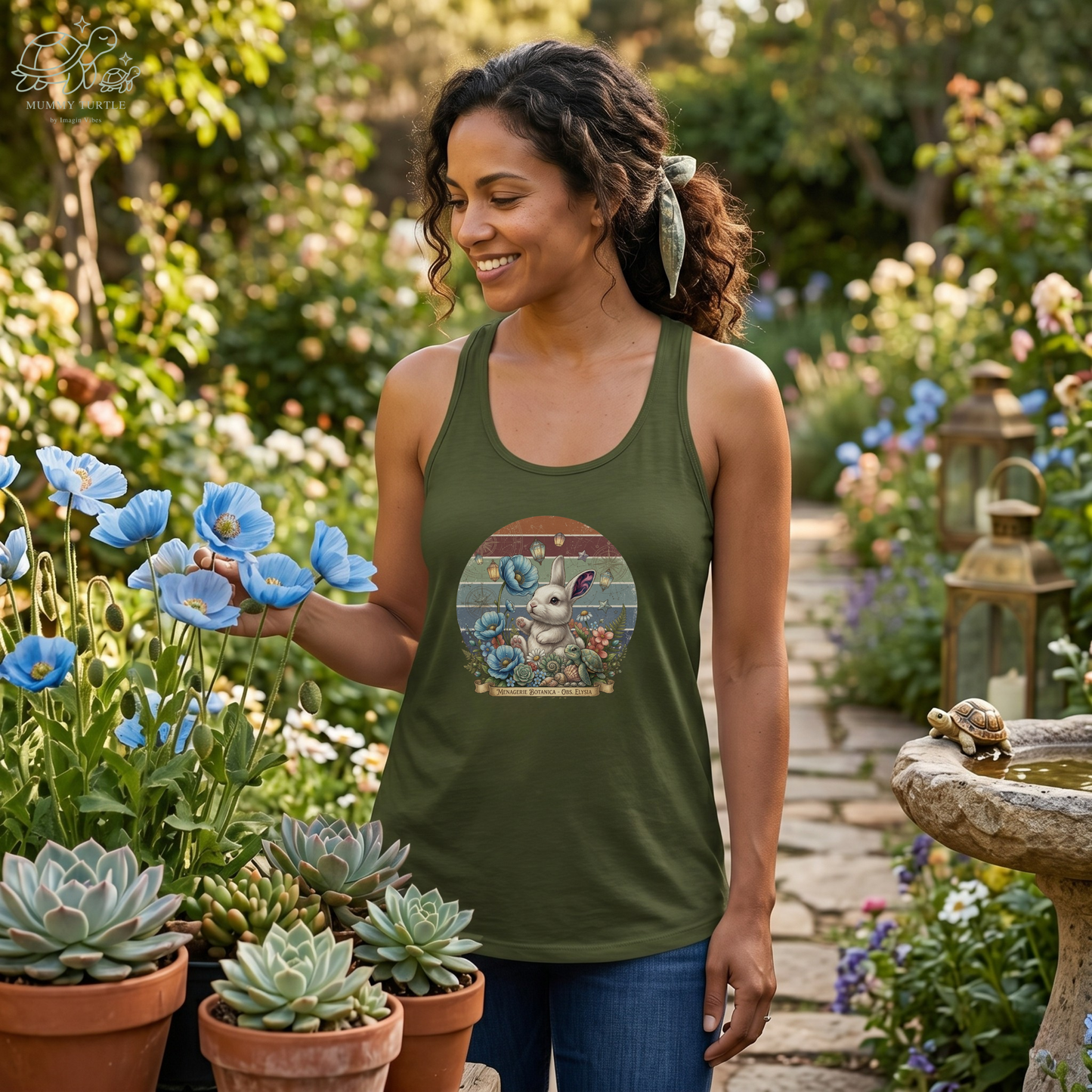 Woman wearing a vintage botanical racerback tank top in a lush garden surrounded by flowers and plants.
