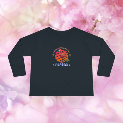 Toddler flamingo long sleeve shirt with colorful adventure design on floral background.