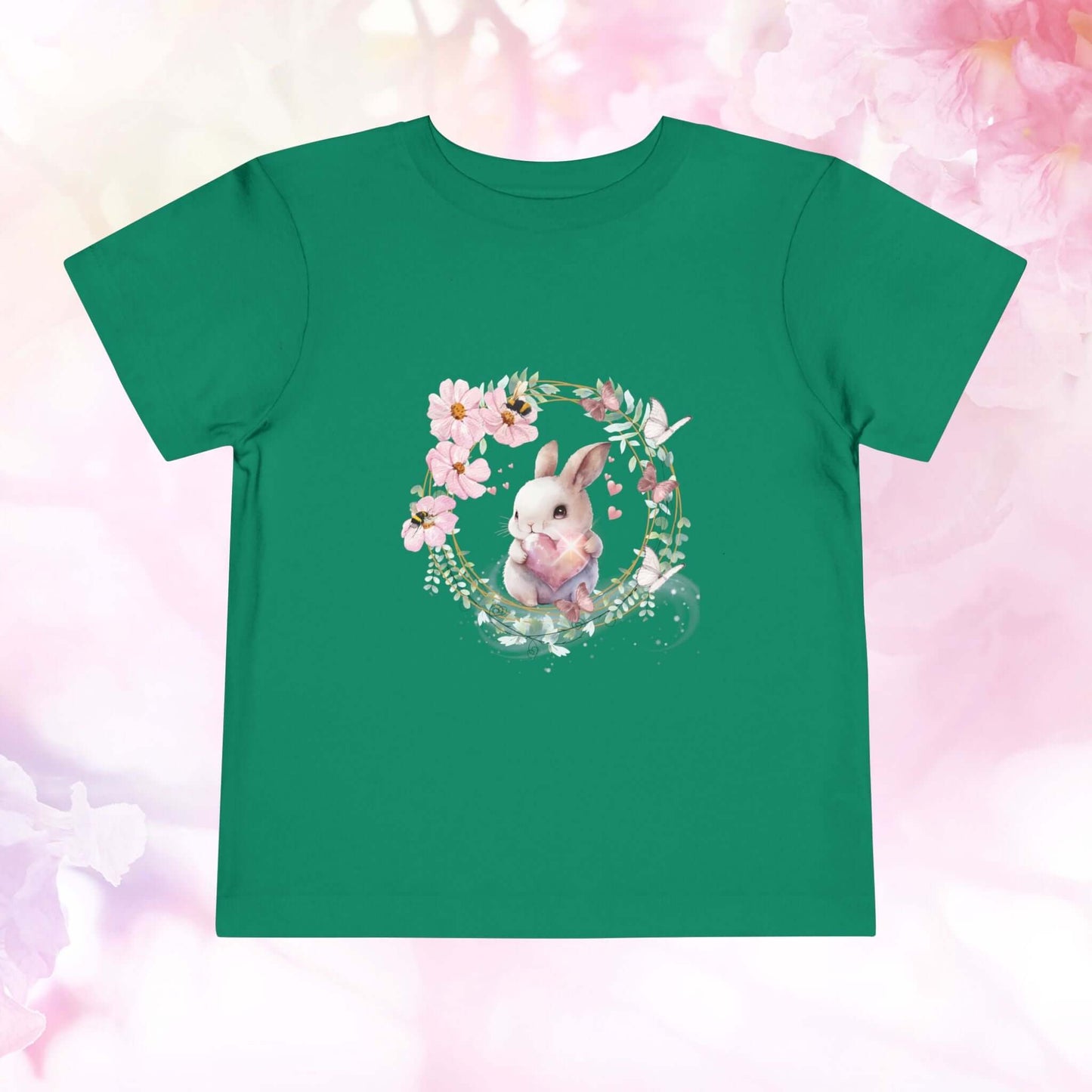 Toddler bunny t-shirt featuring a watercolor bunny surrounded by spring flowers on a green background.