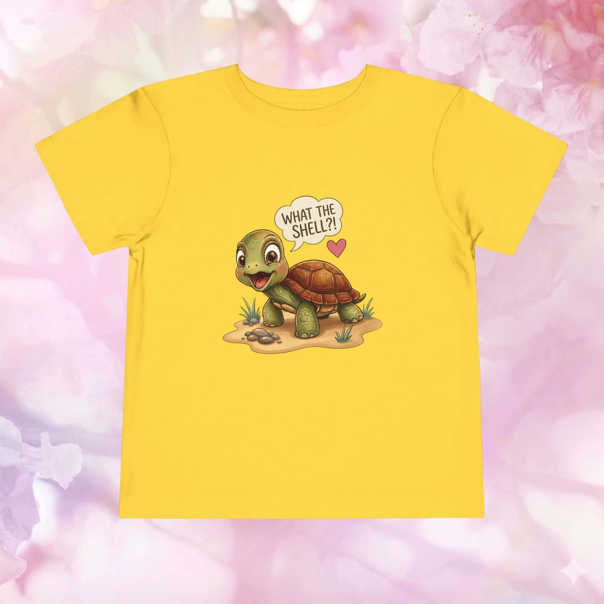 What the Shell?! Toddler Turtle T-Shirt featuring a cute turtle on a yellow background with playful designs.
