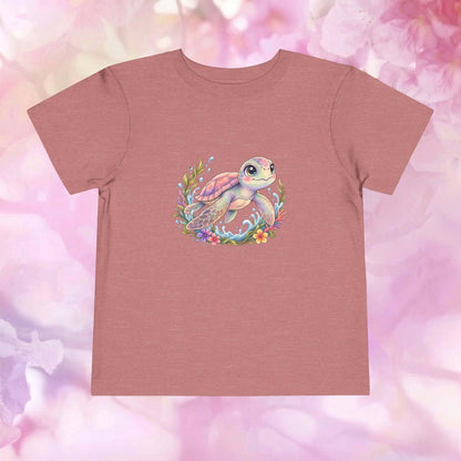 Tidal Grace Toddler T-Shirt featuring a cute sea turtle design surrounded by colorful ocean plants and flowers.