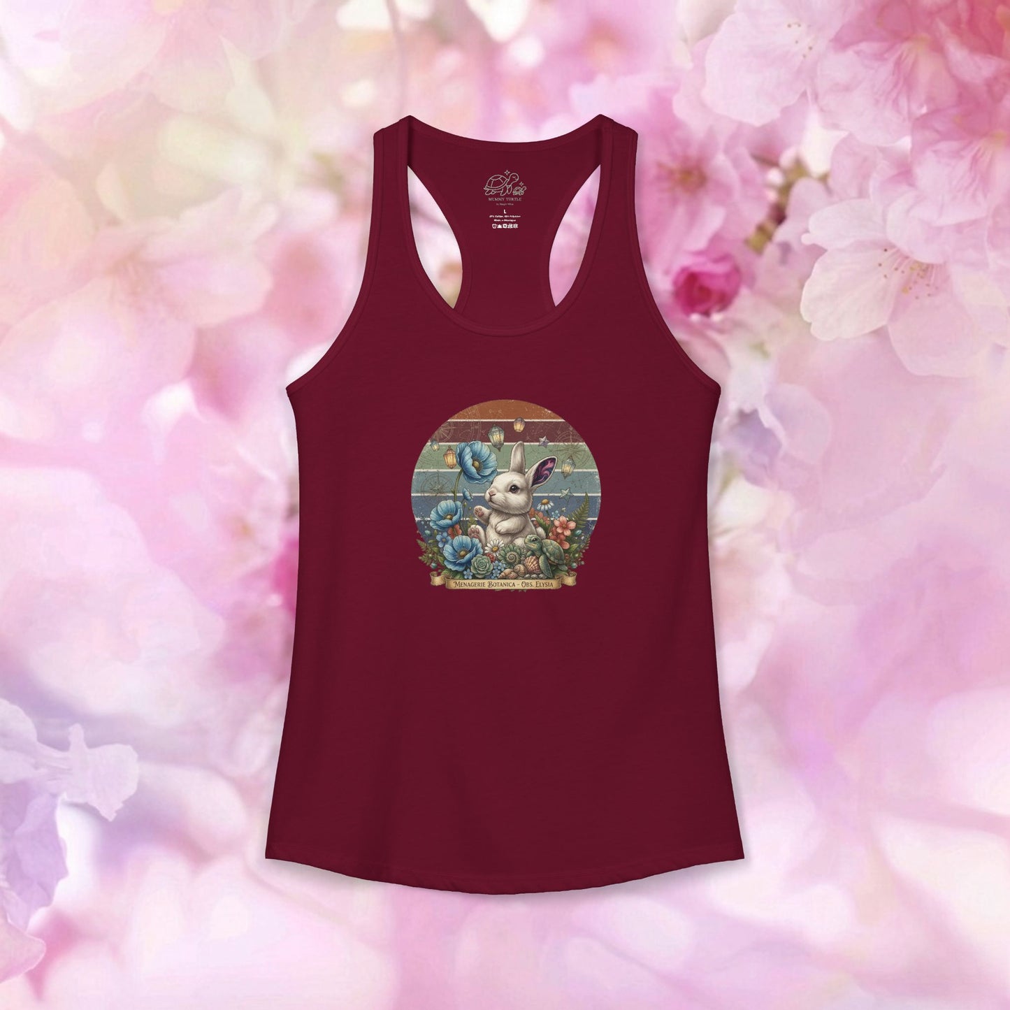 Vintage botanical racerback tank featuring a bunny and blue flowers on a distressed sunset backdrop.