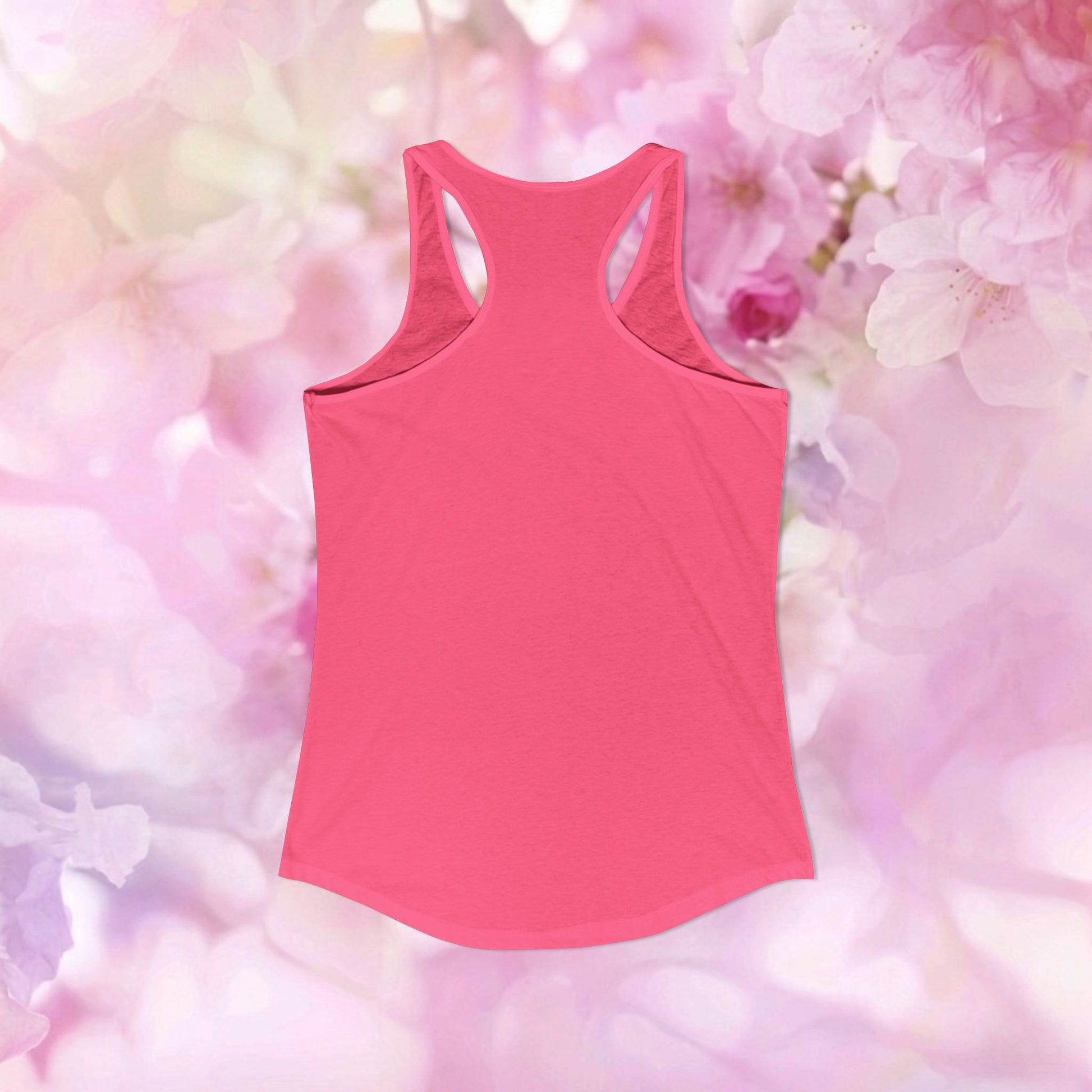 Back view of pink racerback tank top against a soft floral background, featuring the Panda and turtle racerback tank design.