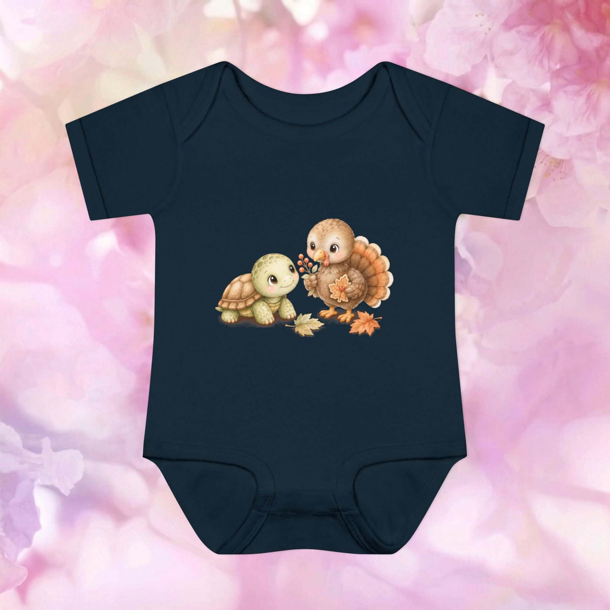 Black Harvest Friends Infant Bodysuit featuring a friendly turtle and turkey design inspired by autumn friendship and Thanksgiving.
