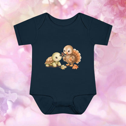 Black Harvest Friends Infant Bodysuit featuring a friendly turtle and turkey design inspired by autumn friendship and Thanksgiving.
