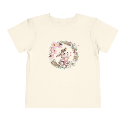 Toddler bunny t-shirt featuring a watercolor bunny surrounded by flowers and whimsical elements.
